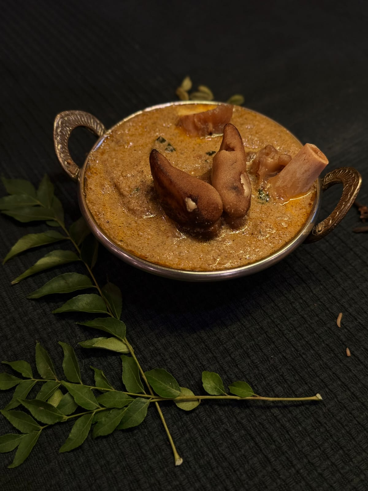 Rich and aromatic South Indian curry with traditional brass serving bowl
