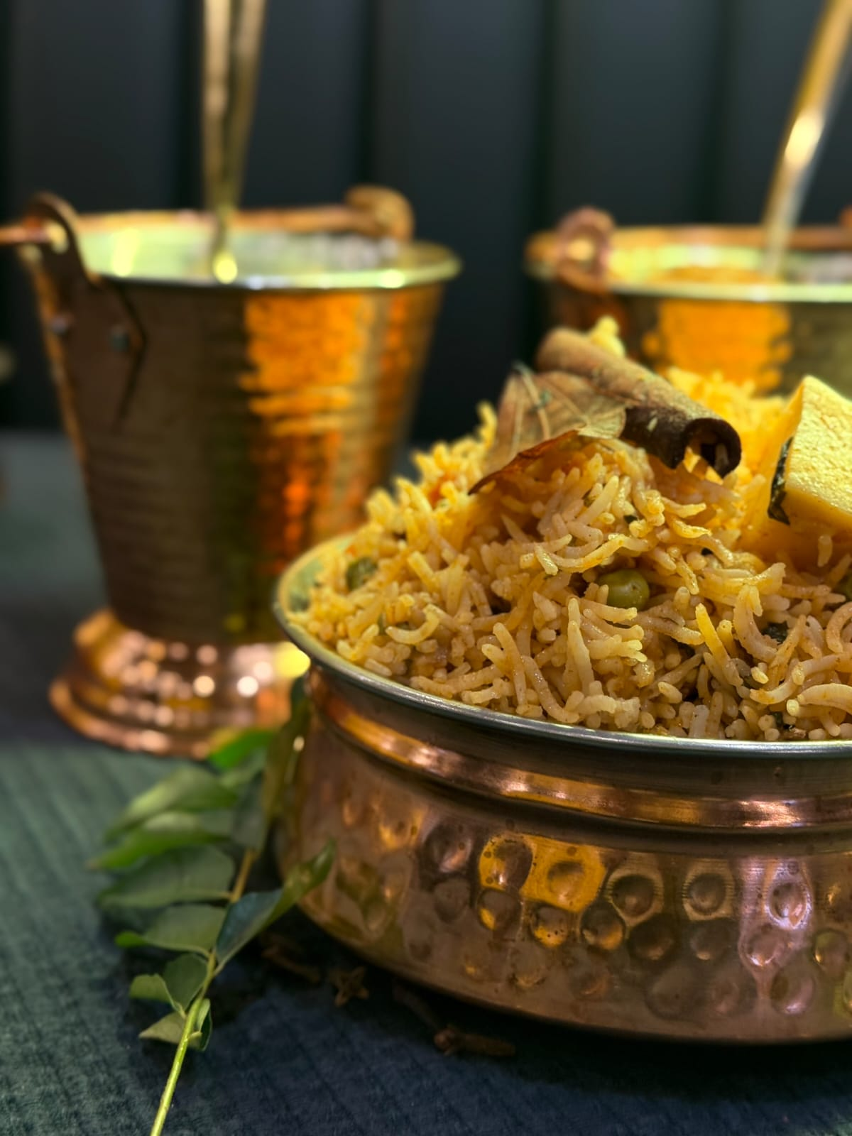 Authentic biryani preparation in traditional copper vessel