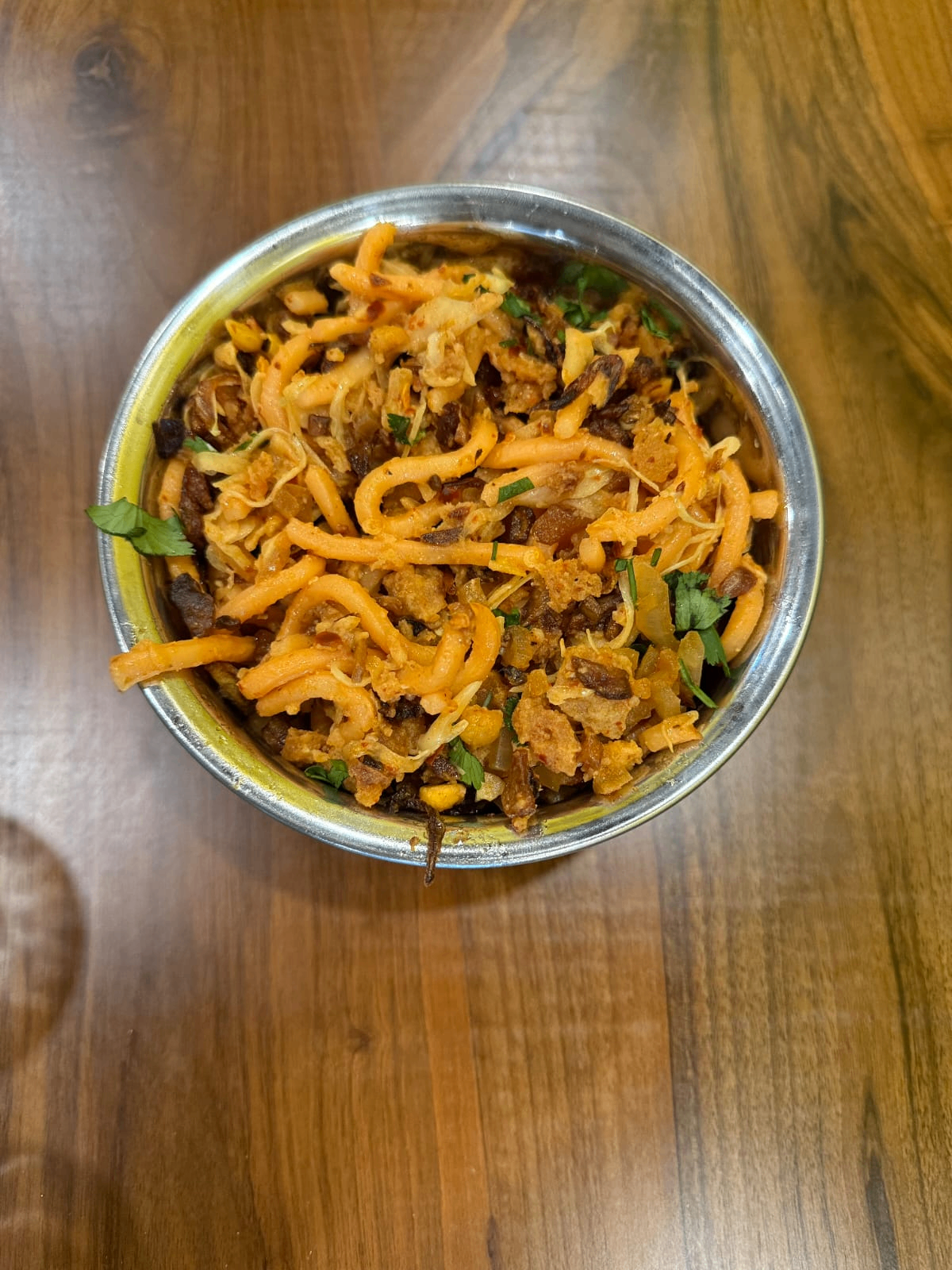 Traditional biryani preparation with authentic spices and garnish